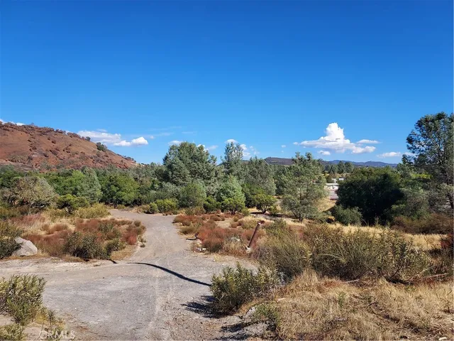a view of a town with mountains in the background
