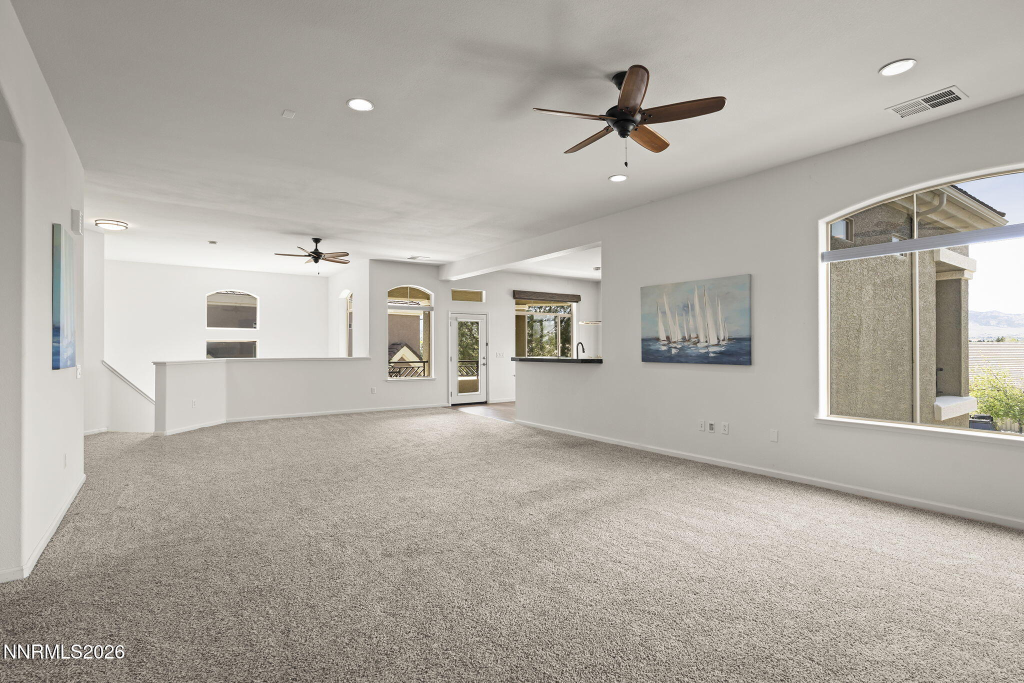 9900 Wilbur May Parkway, Unit 304 Reno, NV 89521 - Photo 9 of 47 a view of a livingroom with furniture ceiling fan and window