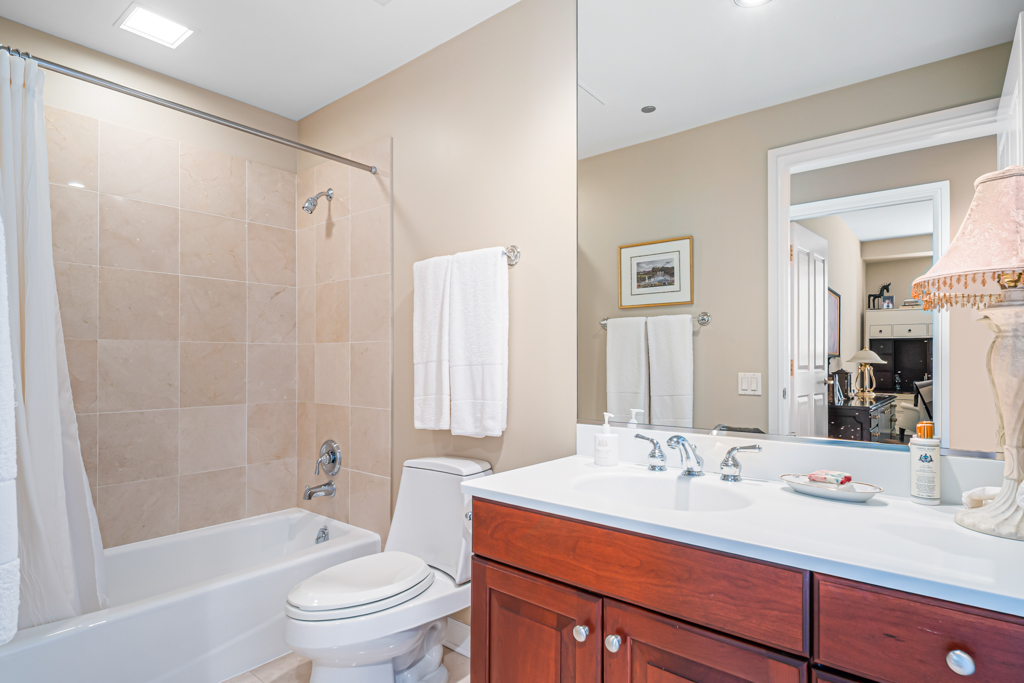 445 East North Water Street, Unit 2003 Chicago, IL 60611 - Photo 11 of 18 a bathroom with a sink toilet tub and shower
