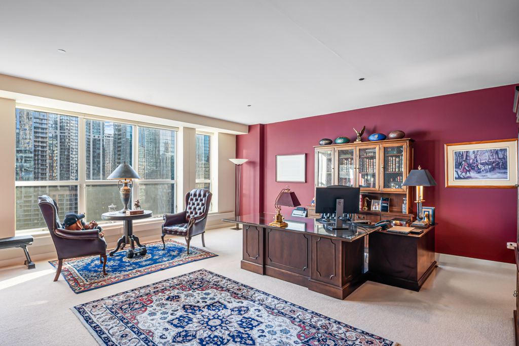 445 East North Water Street, Unit 2003 Chicago, IL 60611 - Photo 7 of 18 a living room with furniture and a rug