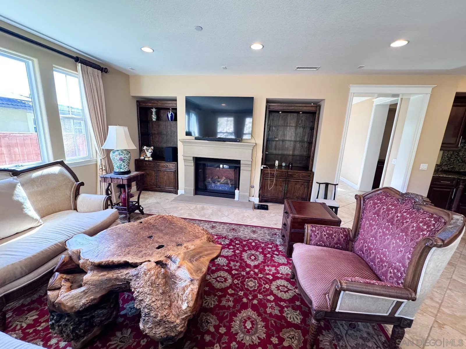 536 Quail Pointe Lane Encinitas, CA 92024 - Photo 11 of 28 a living room with furniture fireplace and window