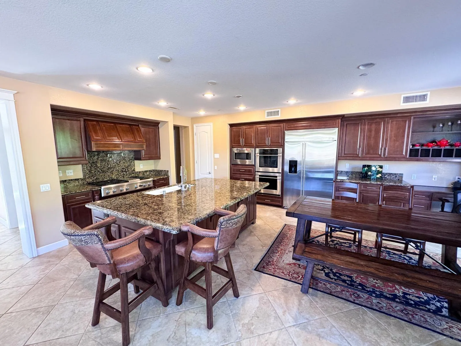 536 Quail Pointe Lane Encinitas, CA 92024 - Photo 10 of 28 a view of a dining room with furniture