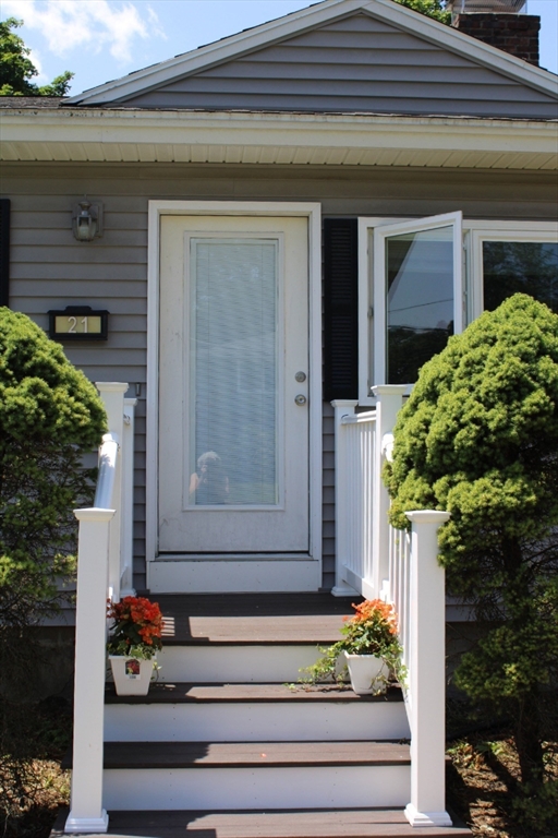 21 Whitcomb Drive Lancaster, MA 01523 - Photo 2 of 23 a front view of a house with a garden