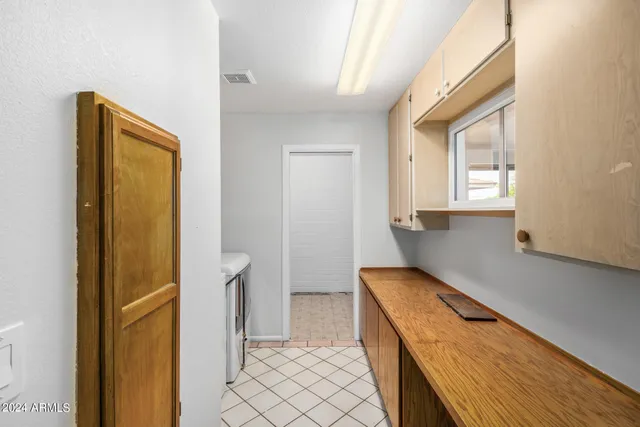 a view of a backyard with a swimming pool