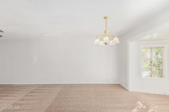 a view of an empty room with a fireplace