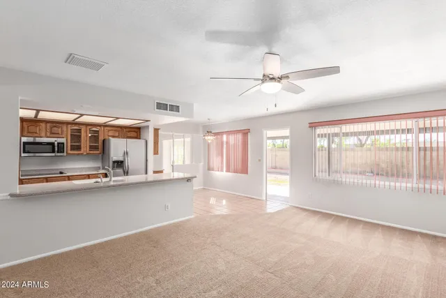 a view of a hallway with a kitchen