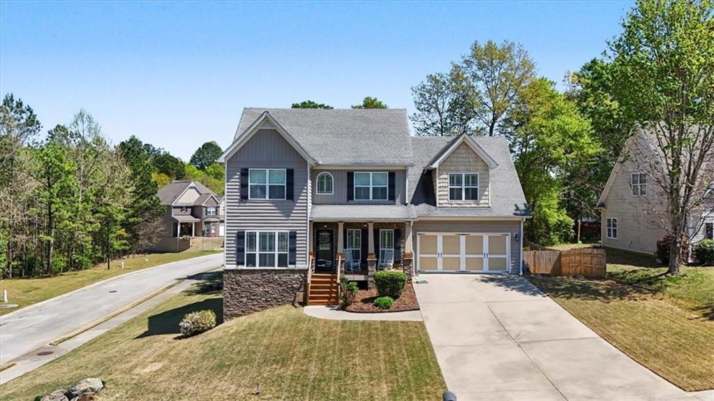 101 Oscar Lane Dallas, GA 30132 - Photo 2 of 55 a front view of a house with a yard