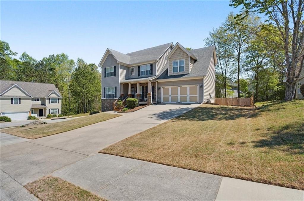 101 Oscar Lane Dallas, GA 30132 - Photo 3 of 55 front view of a house with a street