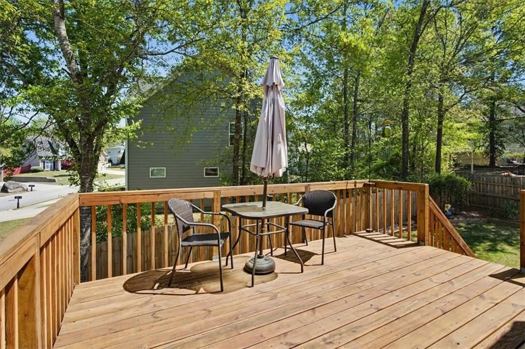 101 Oscar Lane Dallas, GA 30132 - Photo 40 of 55 a view of balcony with wooden floor and outdoor seating