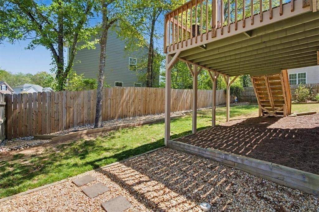 101 Oscar Lane Dallas, GA 30132 - Photo 42 of 55 a view of a yard with wooden fence