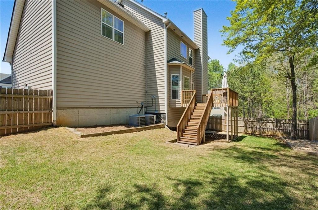 101 Oscar Lane Dallas, GA 30132 - Photo 44 of 55 a view of a house with a backyard