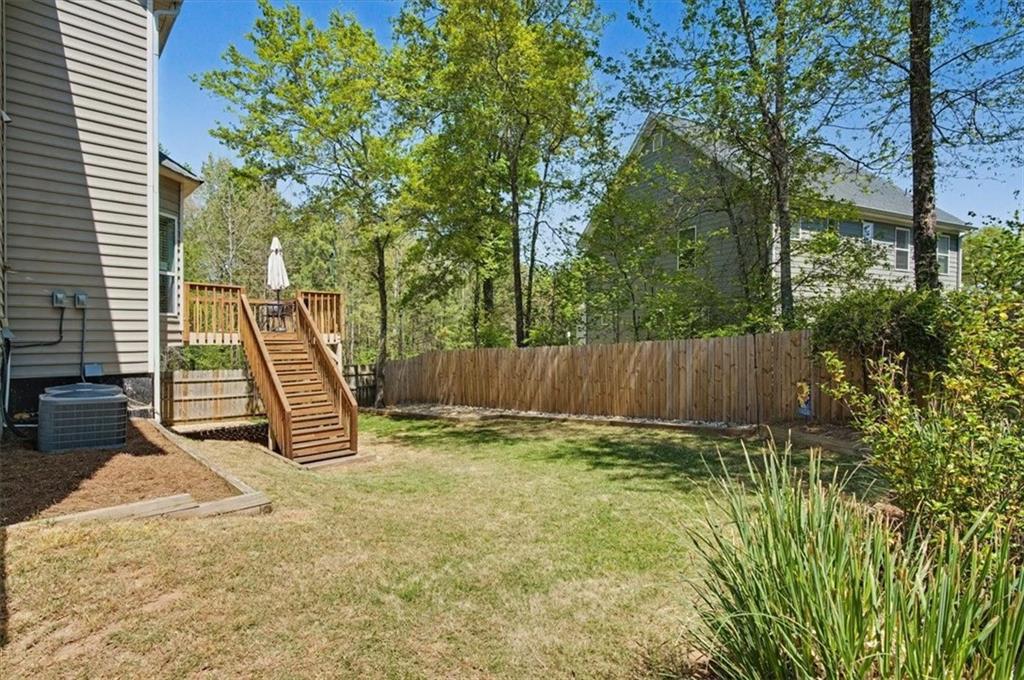101 Oscar Lane Dallas, GA 30132 - Photo 45 of 55 a view of a backyard with a slide