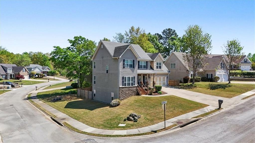 101 Oscar Lane Dallas, GA 30132 - Photo 46 of 55 a view of a house with swimming pool and a yard