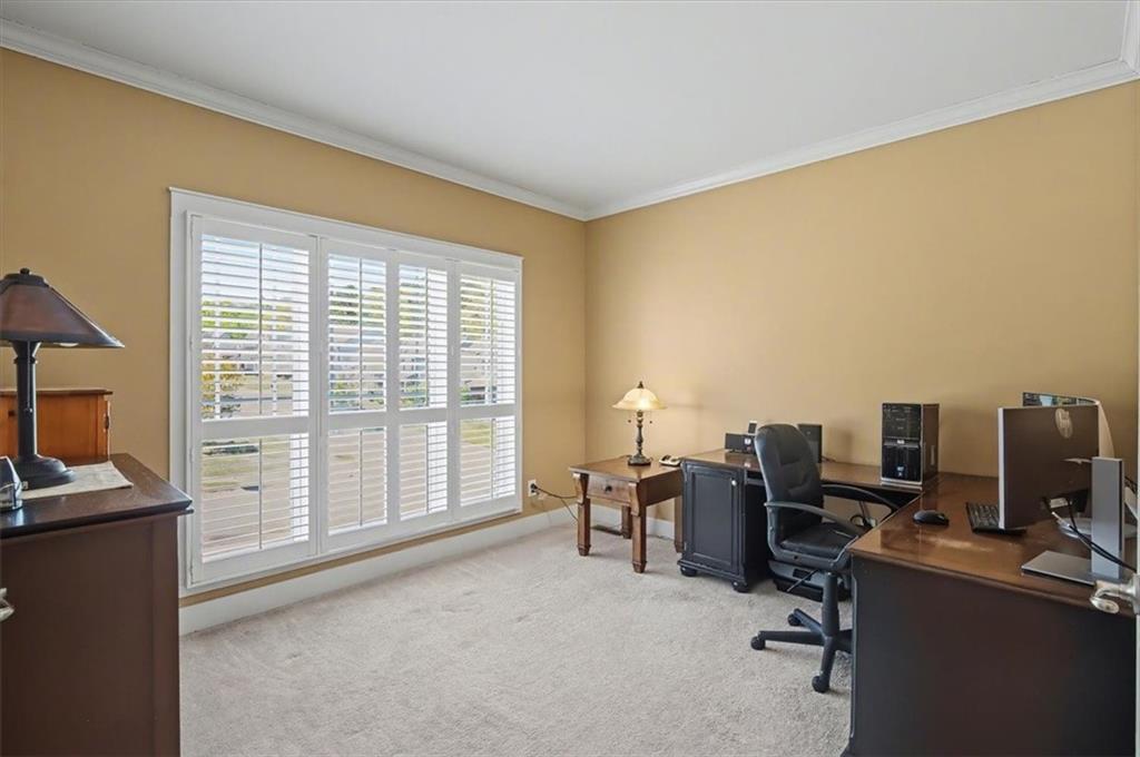 101 Oscar Lane Dallas, GA 30132 - Photo 7 of 55 a view of a workspace with furniture and a window