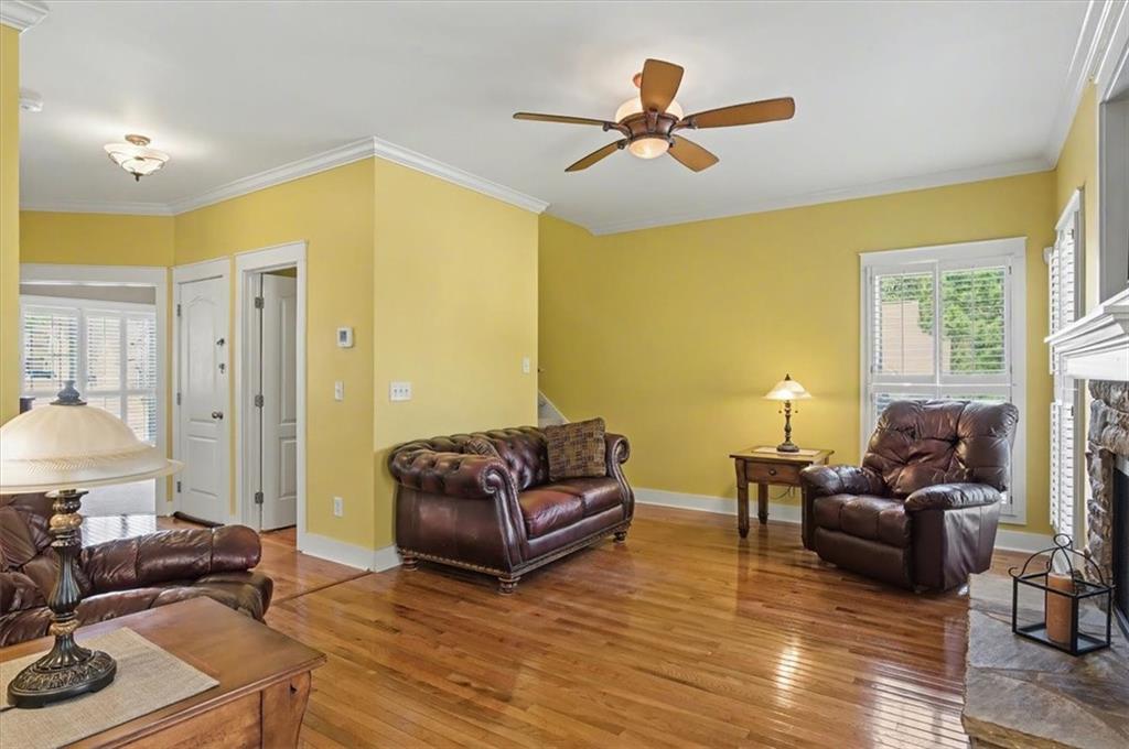 101 Oscar Lane Dallas, GA 30132 - Photo 9 of 55 a living room with furniture a ceiling fan and a window