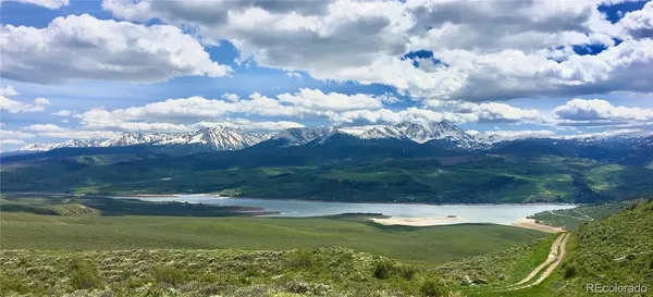 a view of an ocean and a mountain