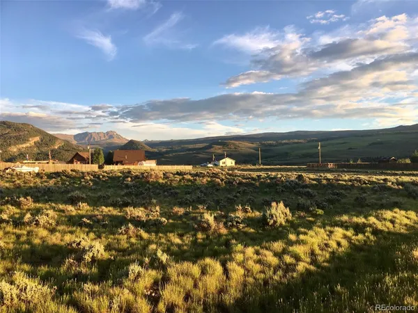 a view of a yard with an ocean