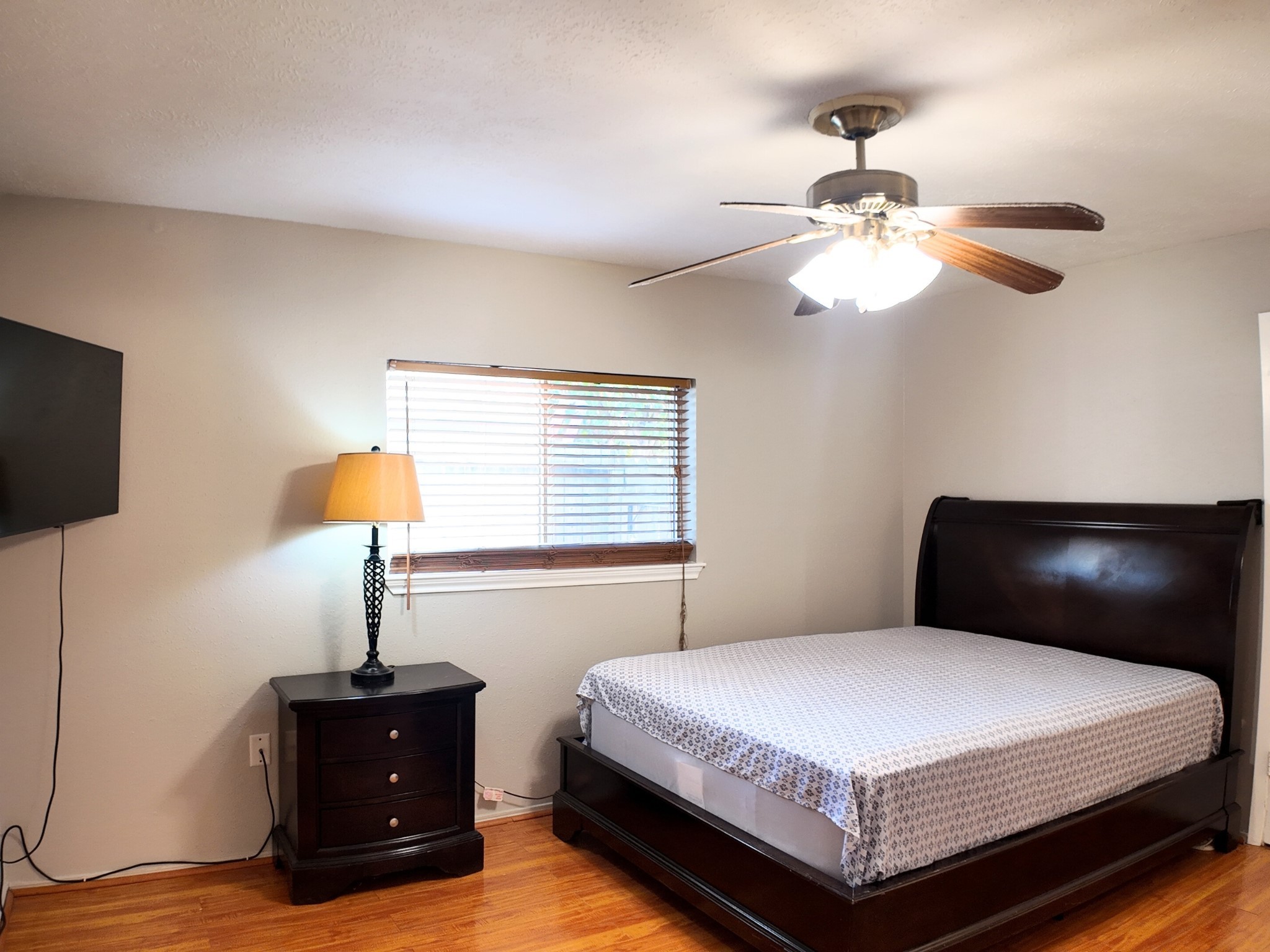 10070 Green Valley Lane Houston, TX 77064 - Photo 15 of 27 a bedroom with a bed and a flat screen tv