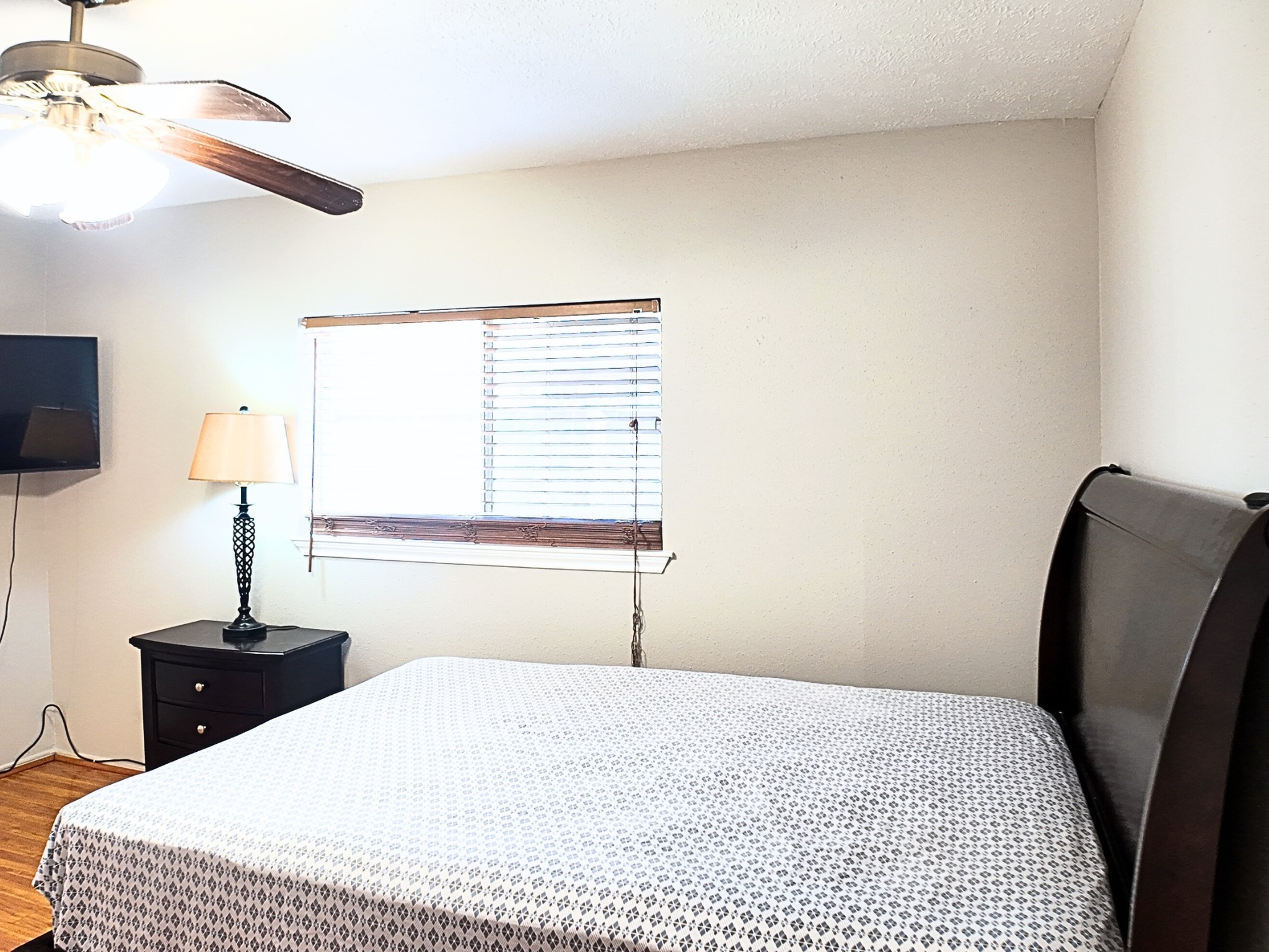 10070 Green Valley Lane Houston, TX 77064 - Photo 16 of 27 a bedroom with a bed and a window