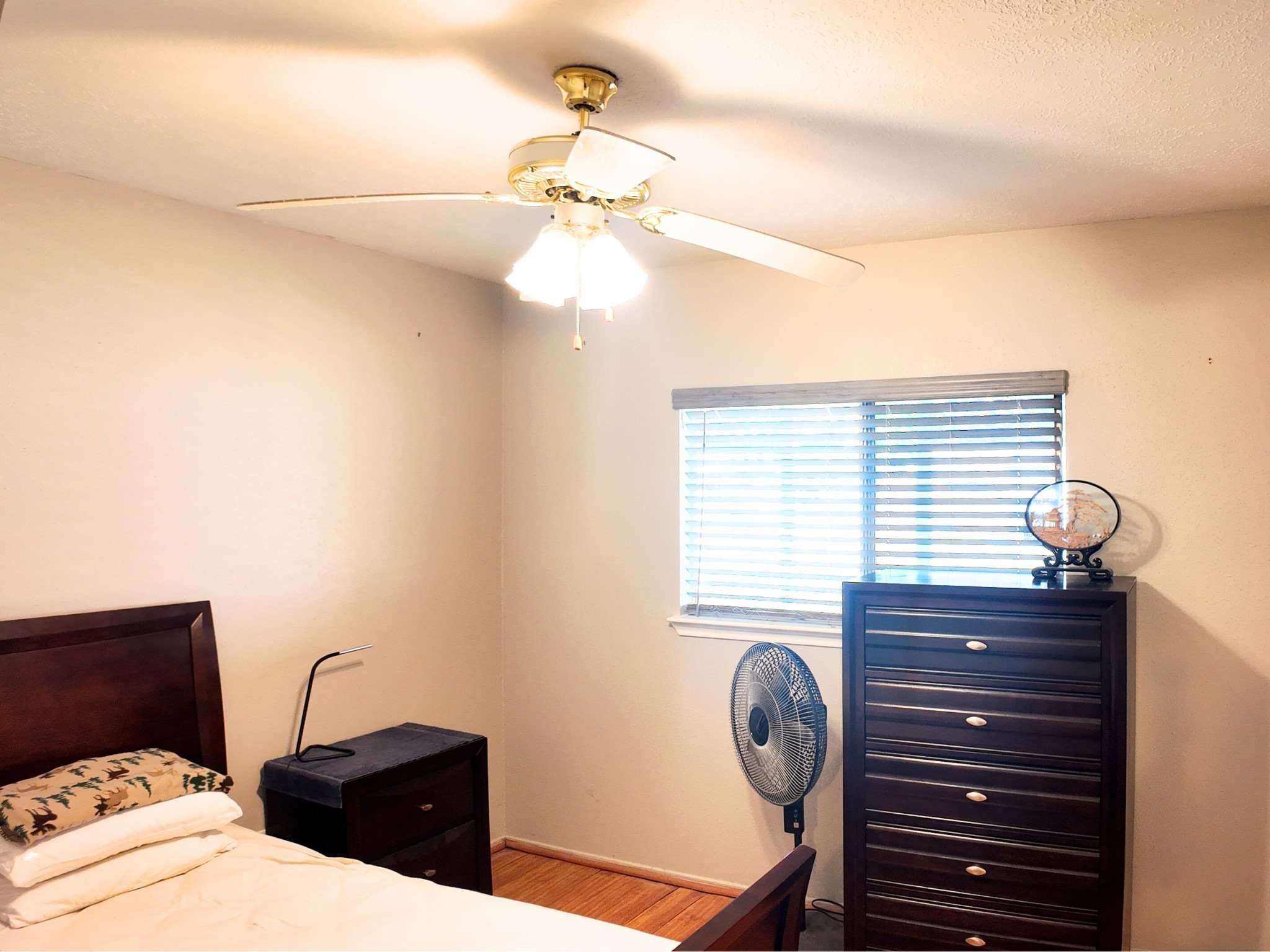 10070 Green Valley Lane Houston, TX 77064 - Photo 17 of 27 a bedroom with a bed and cabinets
