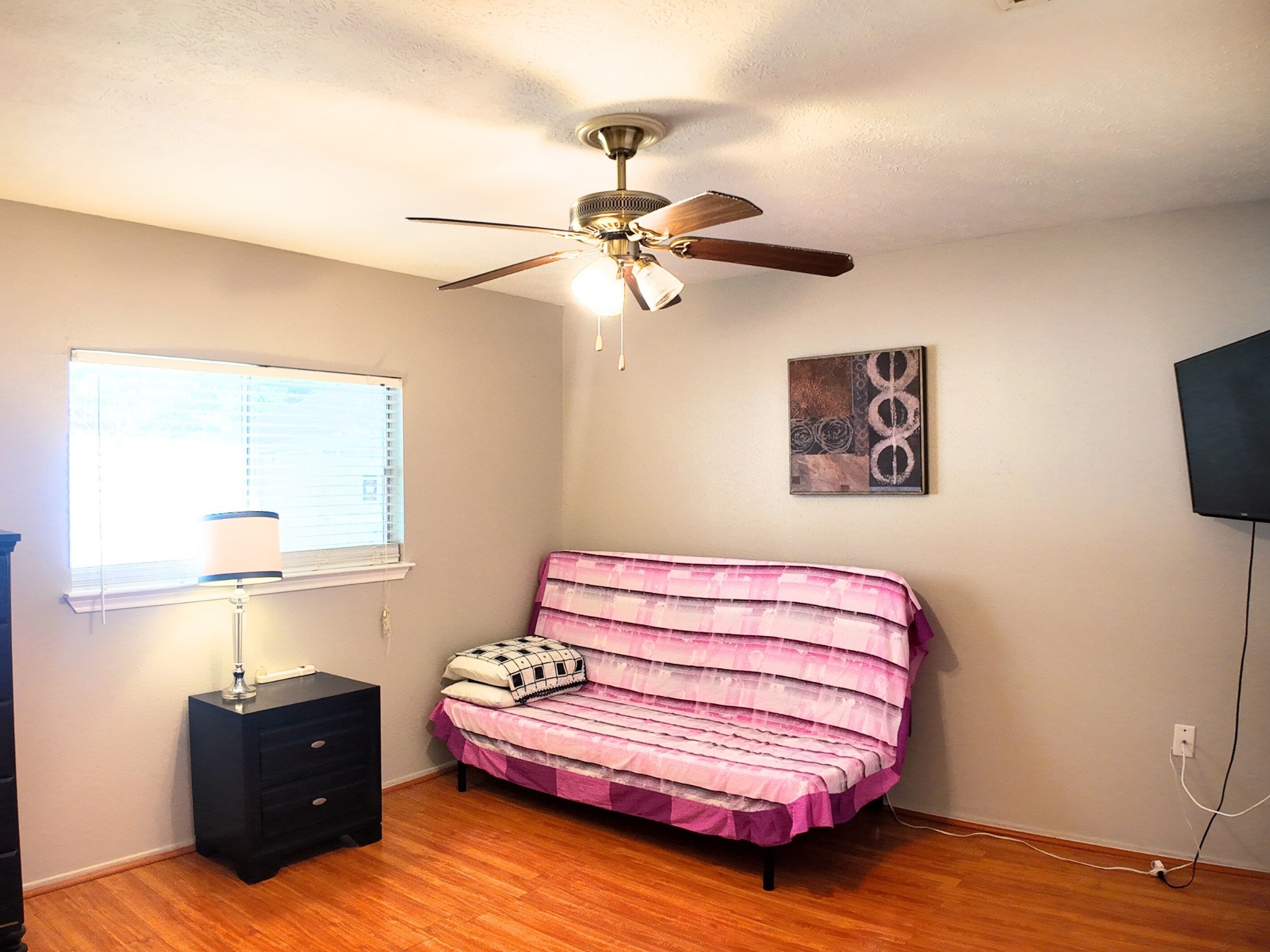 10070 Green Valley Lane Houston, TX 77064 - Photo 19 of 27 a bedroom with a bed and a lamp on the dresser