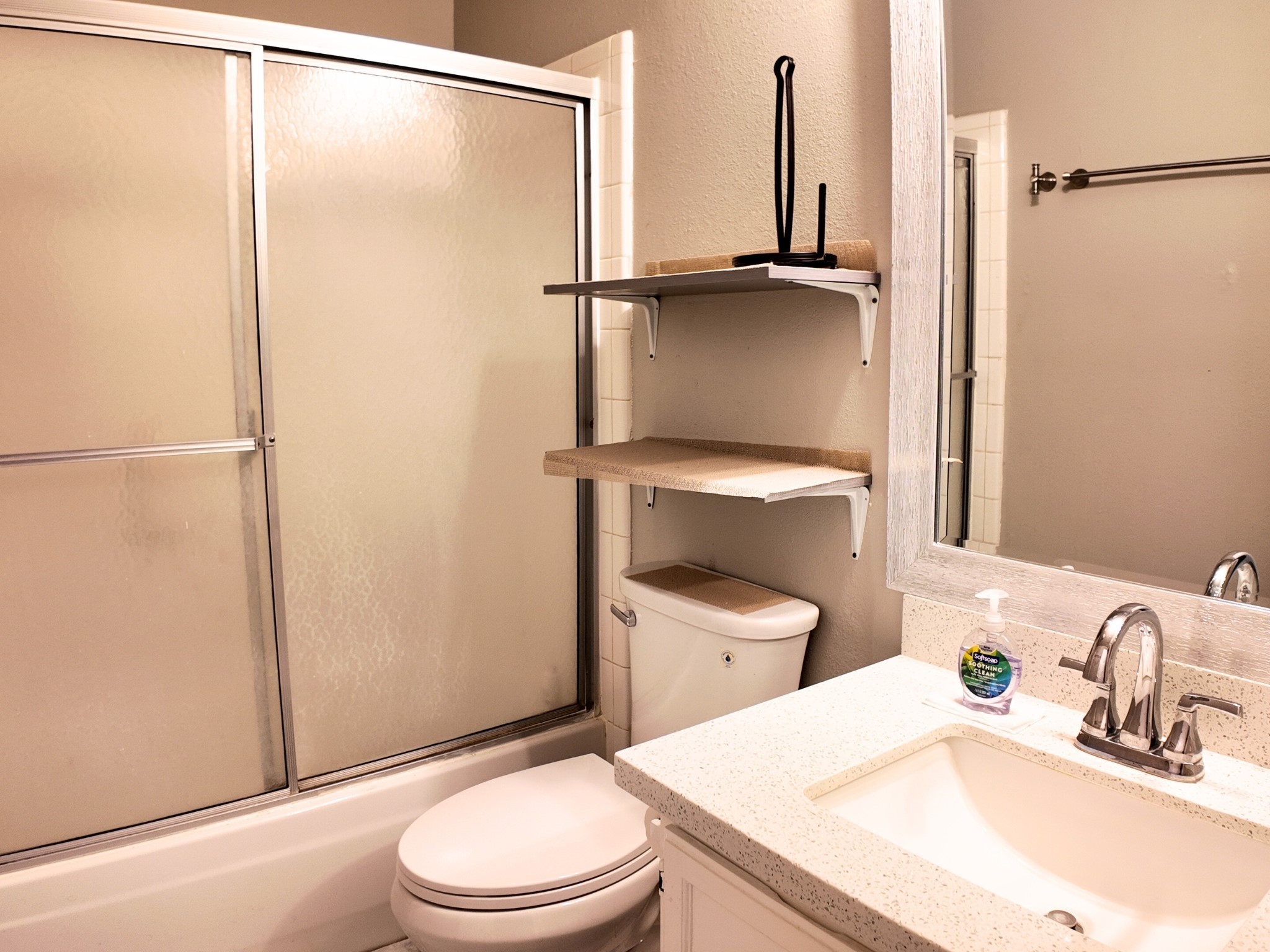 10070 Green Valley Lane Houston, TX 77064 - Photo 20 of 27 a bathroom with a granite countertop sink toilet and a mirror