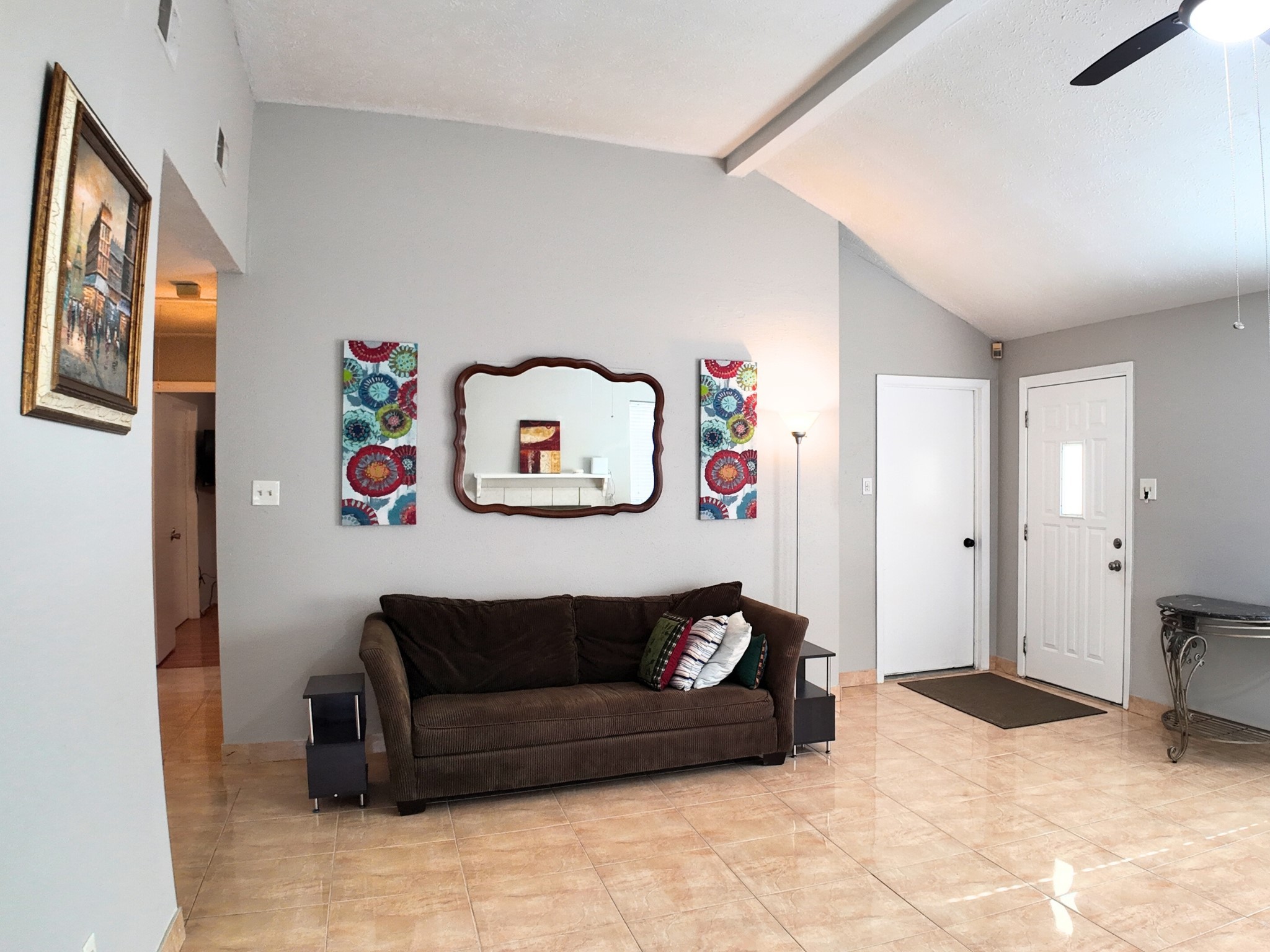 10070 Green Valley Lane Houston, TX 77064 - Photo 5 of 27 a living room with furniture and a refrigerator