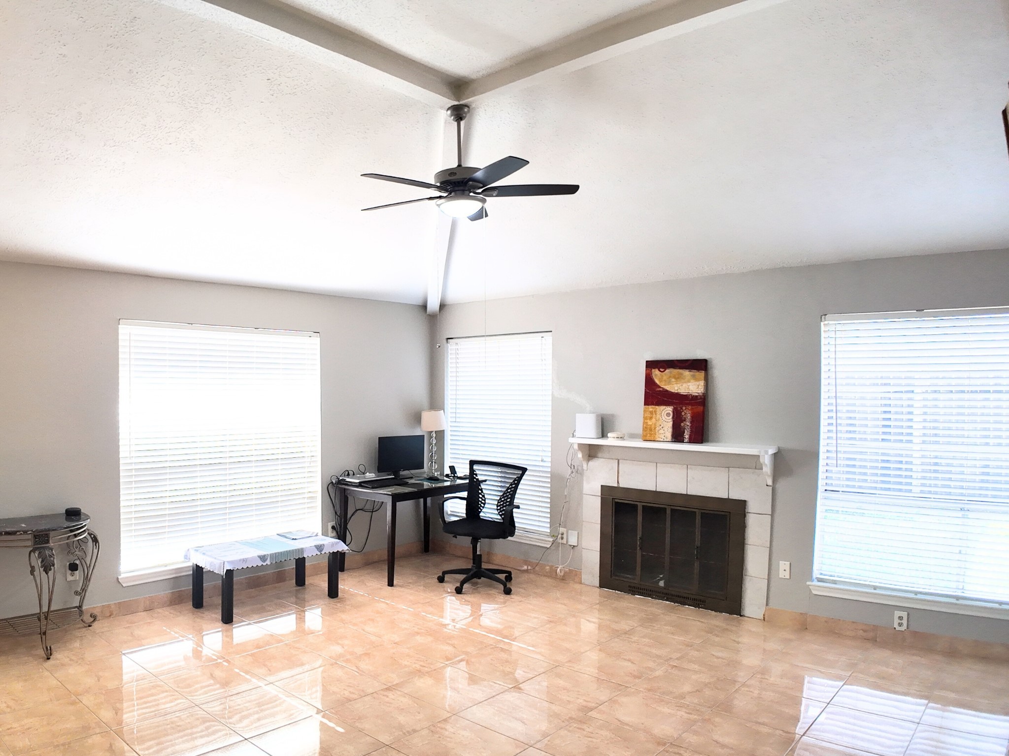 10070 Green Valley Lane Houston, TX 77064 - Photo 7 of 27 a living room with furniture a fireplace and a large window
