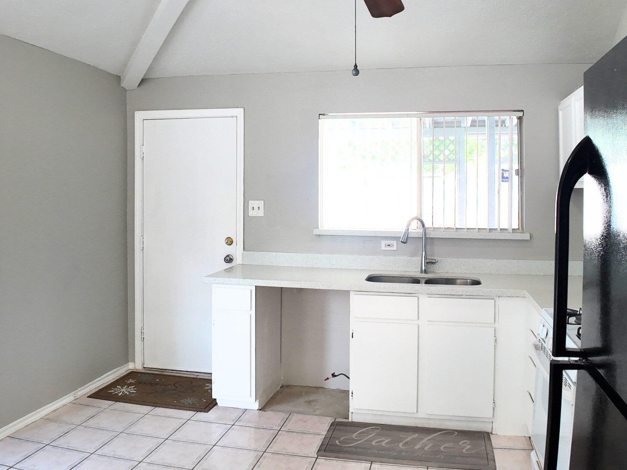 10070 Green Valley Lane Houston, TX 77064 - Photo 10 of 27 a kitchen with a sink cabinets and window