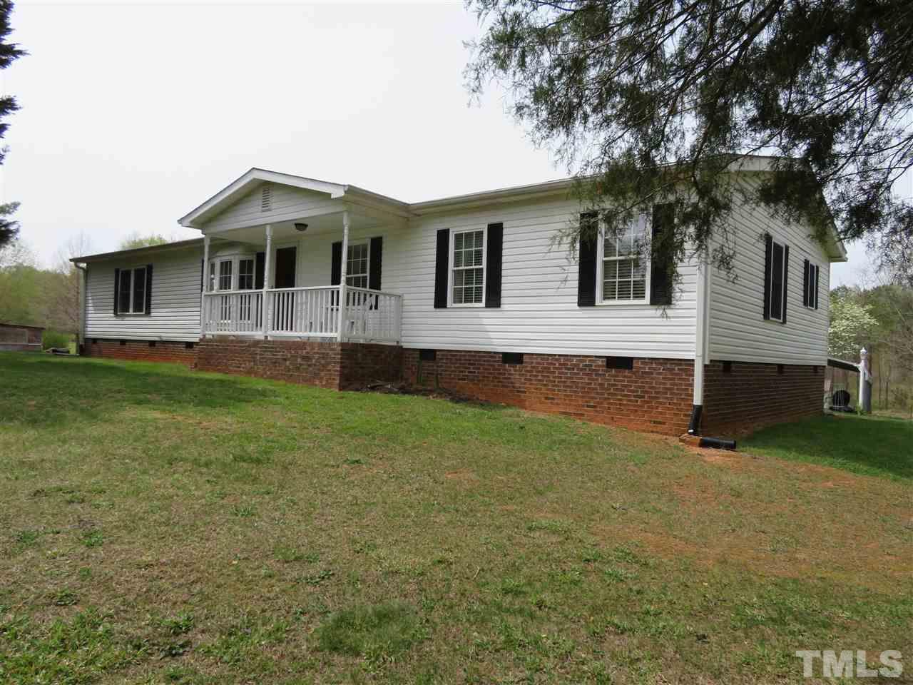 4481 Pixley Pritchard Road Timberlake, NC 27583 - Photo 1 of 25 front view of house with a yard