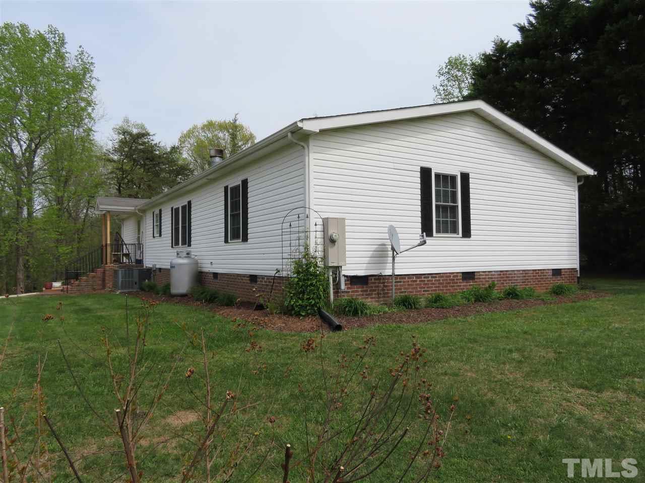 4481 Pixley Pritchard Road Timberlake, NC 27583 - Photo 2 of 25 a view of a house with a yard