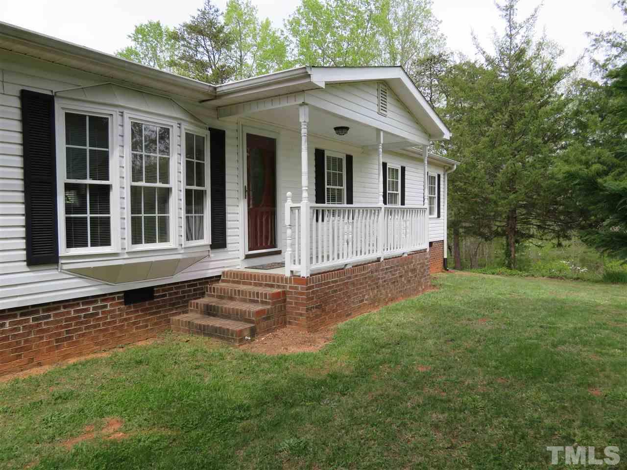4481 Pixley Pritchard Road Timberlake, NC 27583 - Photo 3 of 25 a front view of a house with a yard