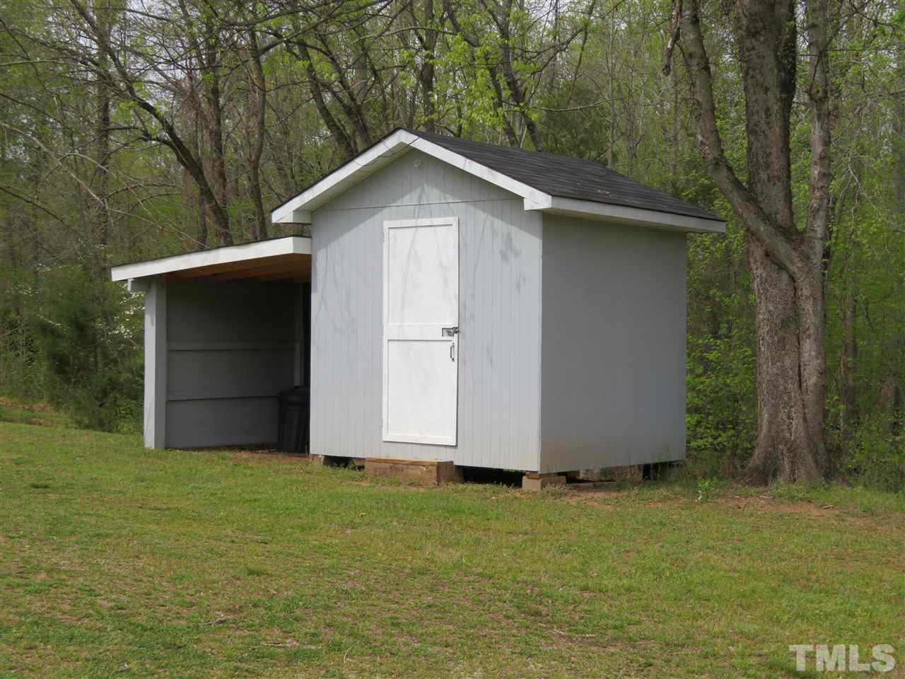 4481 Pixley Pritchard Road Timberlake, NC 27583 - Photo 24 of 25 a wooden house with a outdoor space