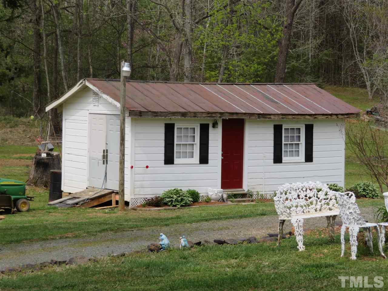 4481 Pixley Pritchard Road Timberlake, NC 27583 - Photo 6 of 25 a backyard of a house with table and chairs