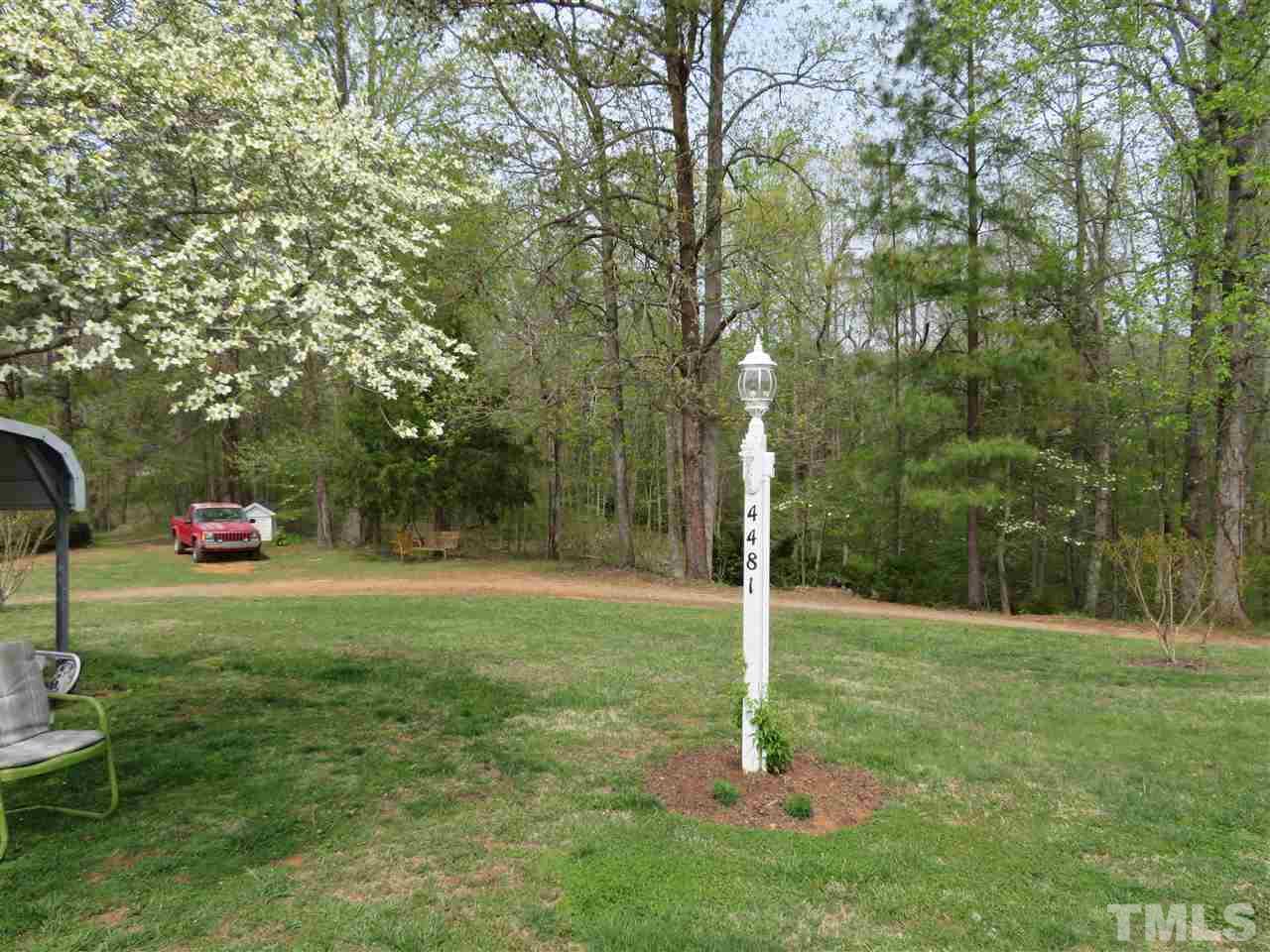 4481 Pixley Pritchard Road Timberlake, NC 27583 - Photo 7 of 25 a backyard of a house with lots of green space