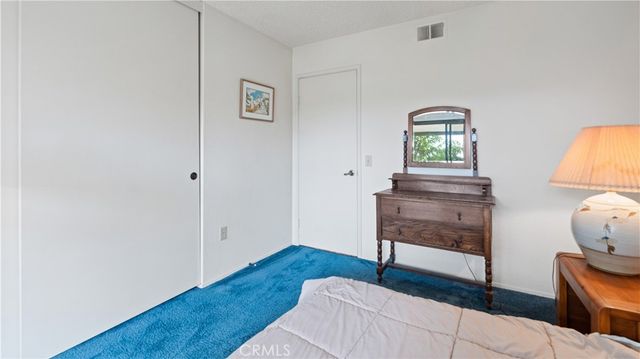 a bathroom with a granite countertop shower sink and mirror