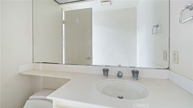 a kitchen with a sink cabinets and appliances