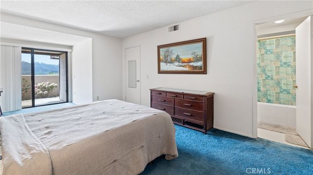 a bedroom with a bed and a cabinets
