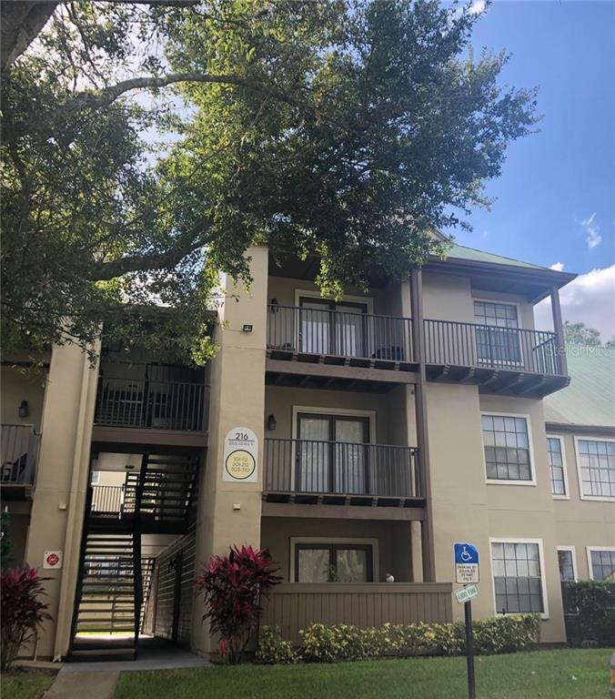 216 Afton Square, Unit 306 Altamonte Springs, FL 32714 - Photo 1 of 1 a front view of a house with garden