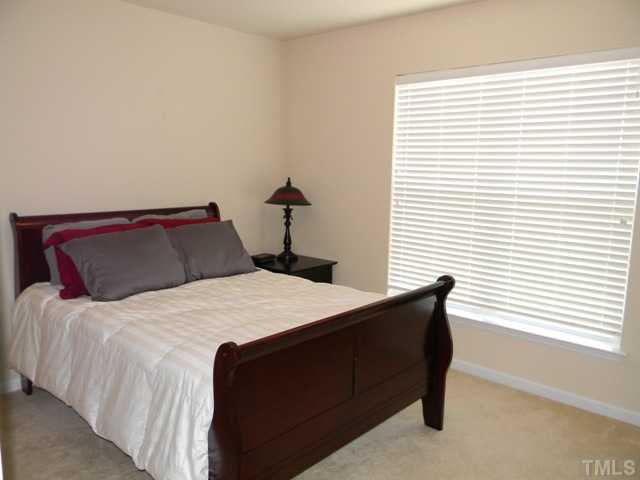 2018 Kedvale Avenue Raleigh, NC 27617 - Photo 12 of 18 a bedroom with a bed and window