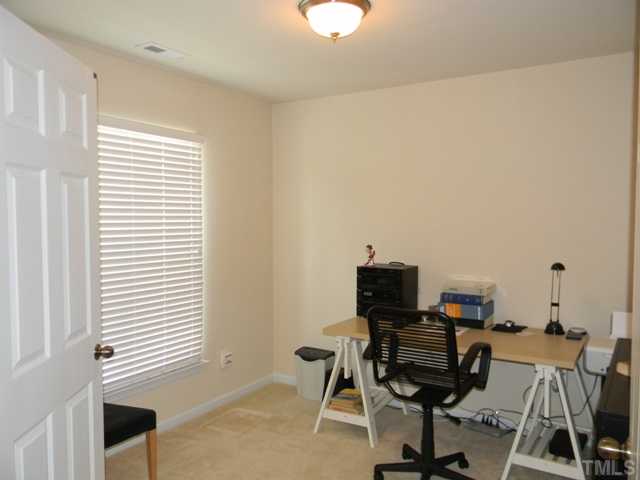 2018 Kedvale Avenue Raleigh, NC 27617 - Photo 13 of 18 a view of a workspace with furniture and a window