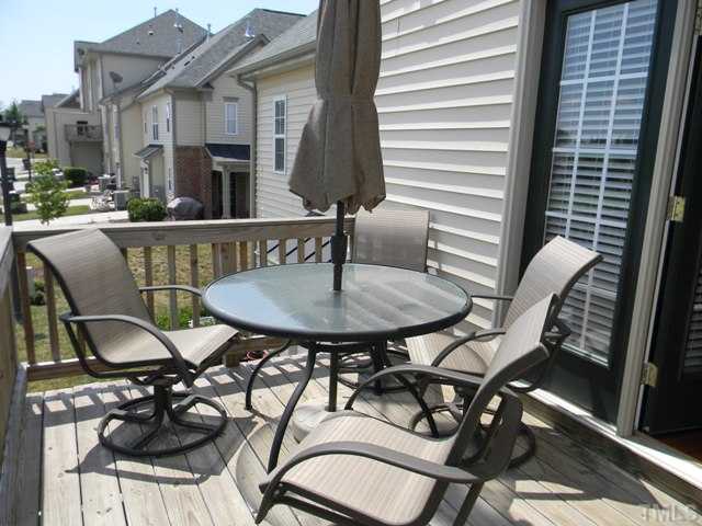 2018 Kedvale Avenue Raleigh, NC 27617 - Photo 15 of 18 a balcony with table and chairs