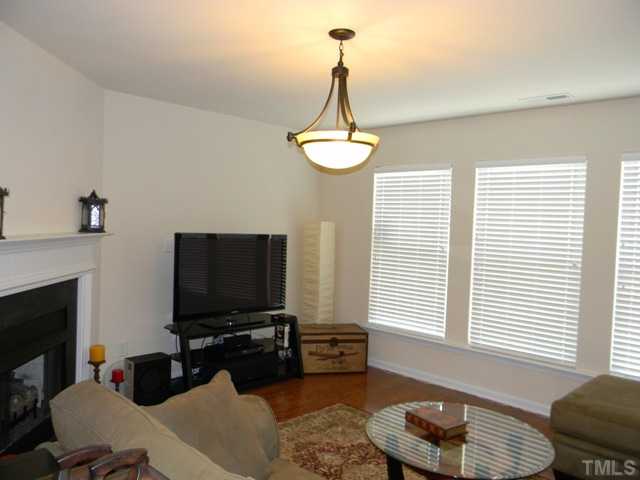 2018 Kedvale Avenue Raleigh, NC 27617 - Photo 5 of 18 a living room with furniture and a flat screen tv