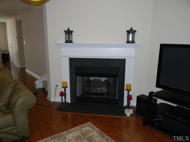 2018 Kedvale Avenue Raleigh, NC 27617 - Photo 6 of 18 a living room with furniture and a fireplace