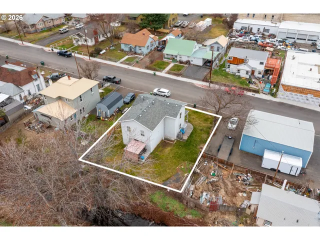 an aerial view of a house with a ocean view