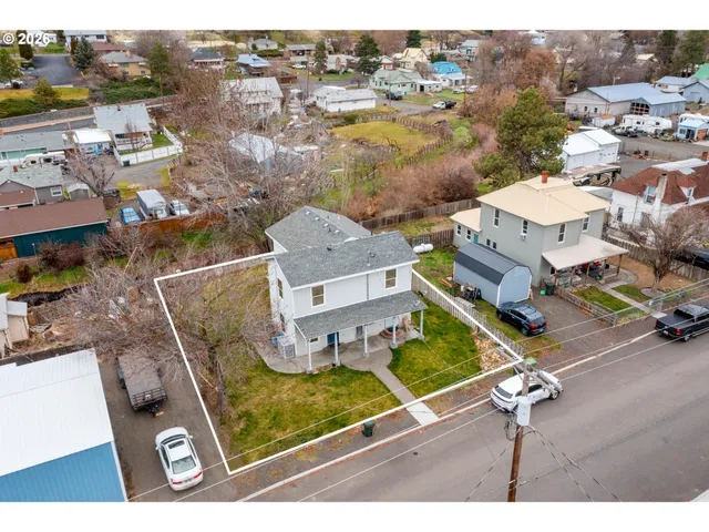 an aerial view of a house with a outdoor space