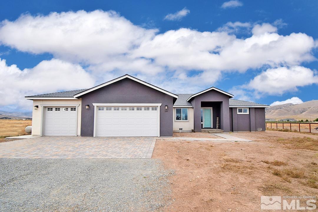 200 Paloma Ranch Court Reno, NV 89510 - Photo 1 of 27 a large house with a yard and garage