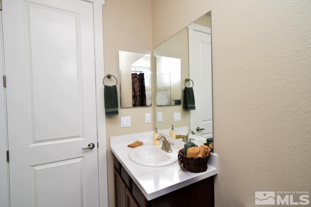 200 Paloma Ranch Court Reno, NV 89510 - Photo 12 of 27 a bathroom with a sink and a mirror