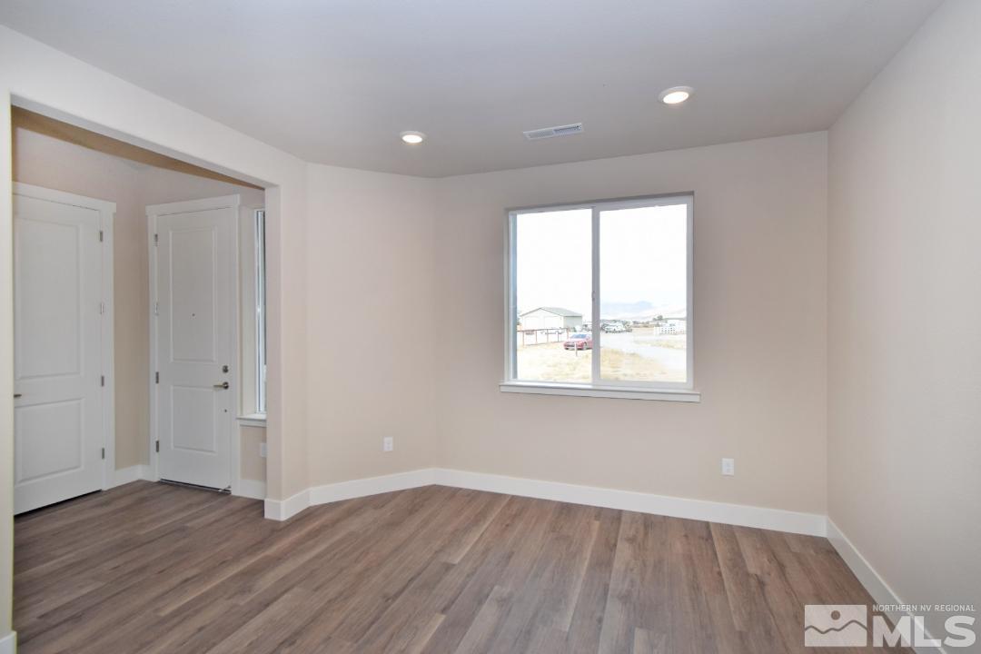 200 Paloma Ranch Court Reno, NV 89510 - Photo 14 of 27 an empty room with wooden floor and windows