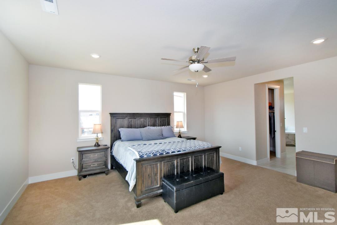 200 Paloma Ranch Court Reno, NV 89510 - Photo 16 of 27 a bedroom with a bed and a ceiling fan